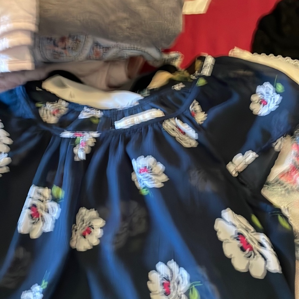 top  is poly used good condition short sleeve ruffles at bottom floral print